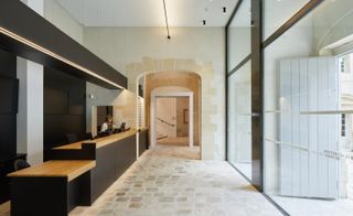 Carnavalet Museum's redesigned reception area with long minimalist desks