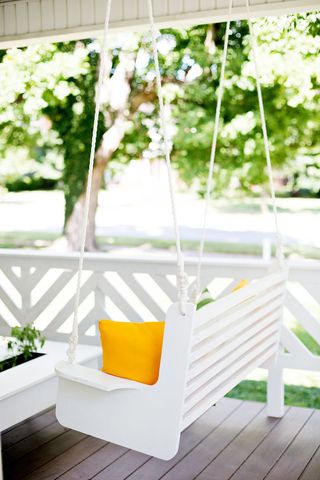white porch swing DIY by abeautifulmess.com