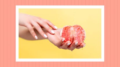 Female hands hold half a grapefruit. Oil is poured on top of the fruit. How to finger someone properly