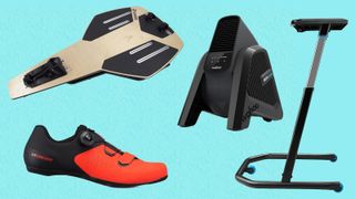 An assortment of turbo training accessories, including a rocker plate, fan, desk and shoe on a blue background