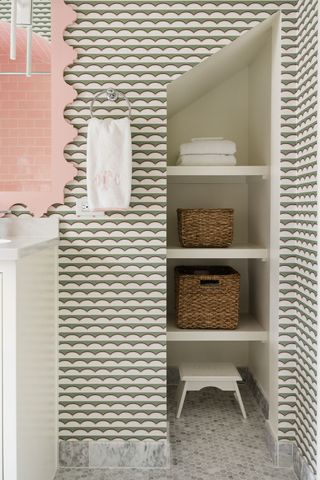 patterned bathroom with towels on display