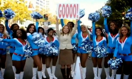 Miami Dolphins Cheerleader performs with her pom poms on the field