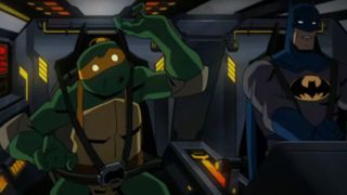 Batman warning Michelangelo not to touch the buttons in the Batmobile in Batman vs. Teenage Mutant Ninja Turtles