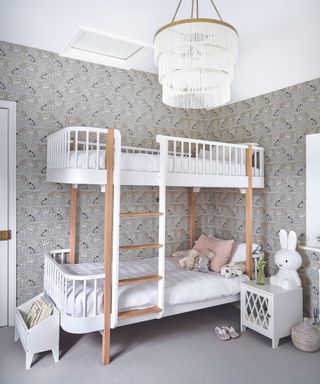 White bunk bed, grey flower wallpaper