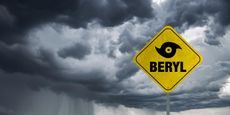 Hurricane Beryl banner with storm clouds background.
