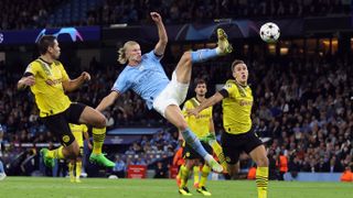 Erling Haaland of Manchester City scores the winning goal during the UEFA Champions League group G match between Manchester City and Borussia Dortmund at Etihad Stadium on September 14, 2022 in Manchester, United Kingdom. 
