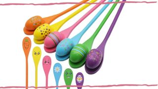 image of colourful wooden spoons with matching wooden eggs on them as an Easter Game