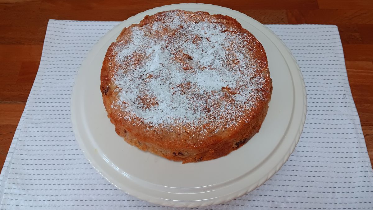 Apple cake on a white cake stand