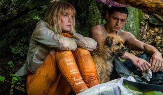 Daisy Ridley and Tom Holland find shelter with a dog in Chaos Walking.