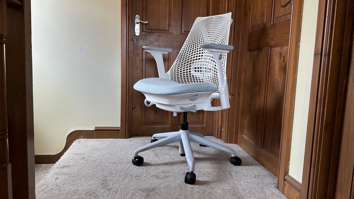Three different shots of the Sayl chair in a hallway.