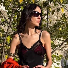 Alexa Chung wearing a black dress.