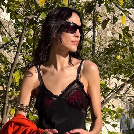 Alexa Chung wearing a black dress.