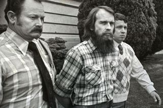 Ron Lafferty being escorted from prison during his trial for the murder of Brenda and Erica Lafferty