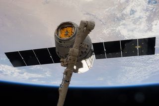 Dragon Capsule Grappled by International Space Station