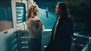 Kate Hudson and Hugh Jackman look at each other in Song Sung Blue.