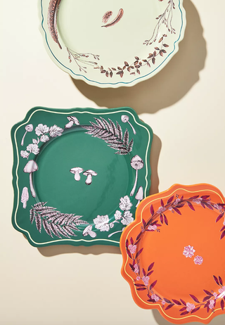 three colorful dinner plates in fancy shapes and with detailed drawing design