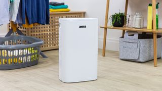 white dehumidifier in a utility room
