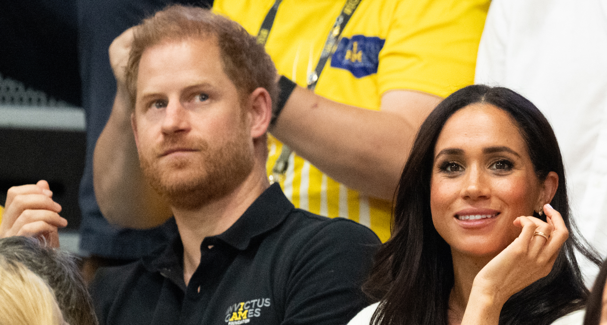 Prince Harry and Meghan Markle sitting in the stands at the Invictus Games