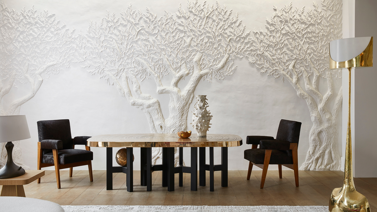 Embossed tree on white dining room wall with contemporary dining room table and sculptural vases