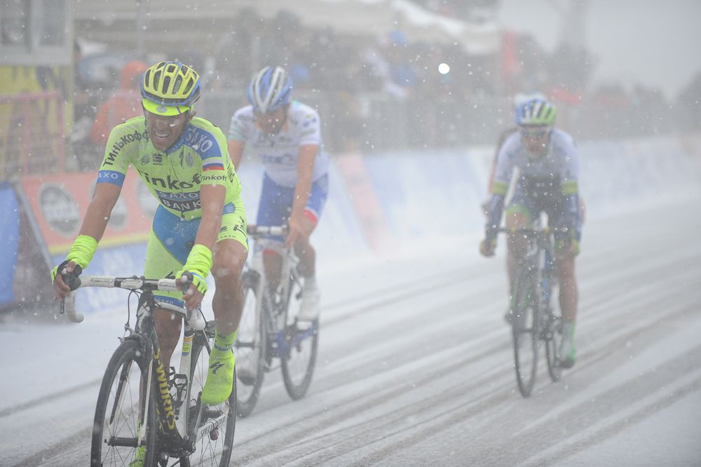 Alberto Contador leads a group in.