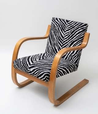 Alvar Aalto armchair with wooden frame and zebra print upholstery
