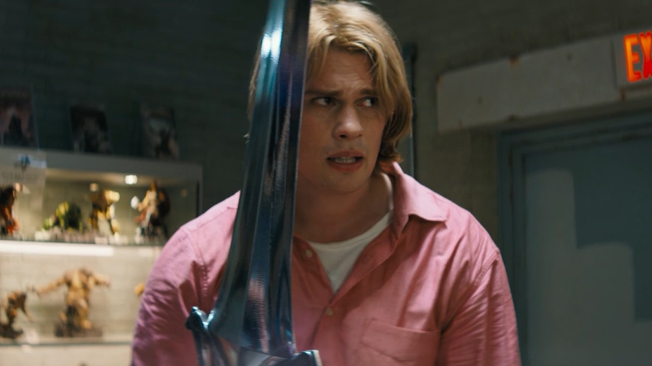 Nicholas Galitzine holding the sword and looking nervous in Masters of the Universe