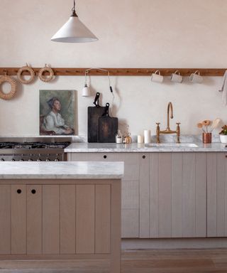 Gray and white kitchen with deVOL cabinets designed by Ellei Home