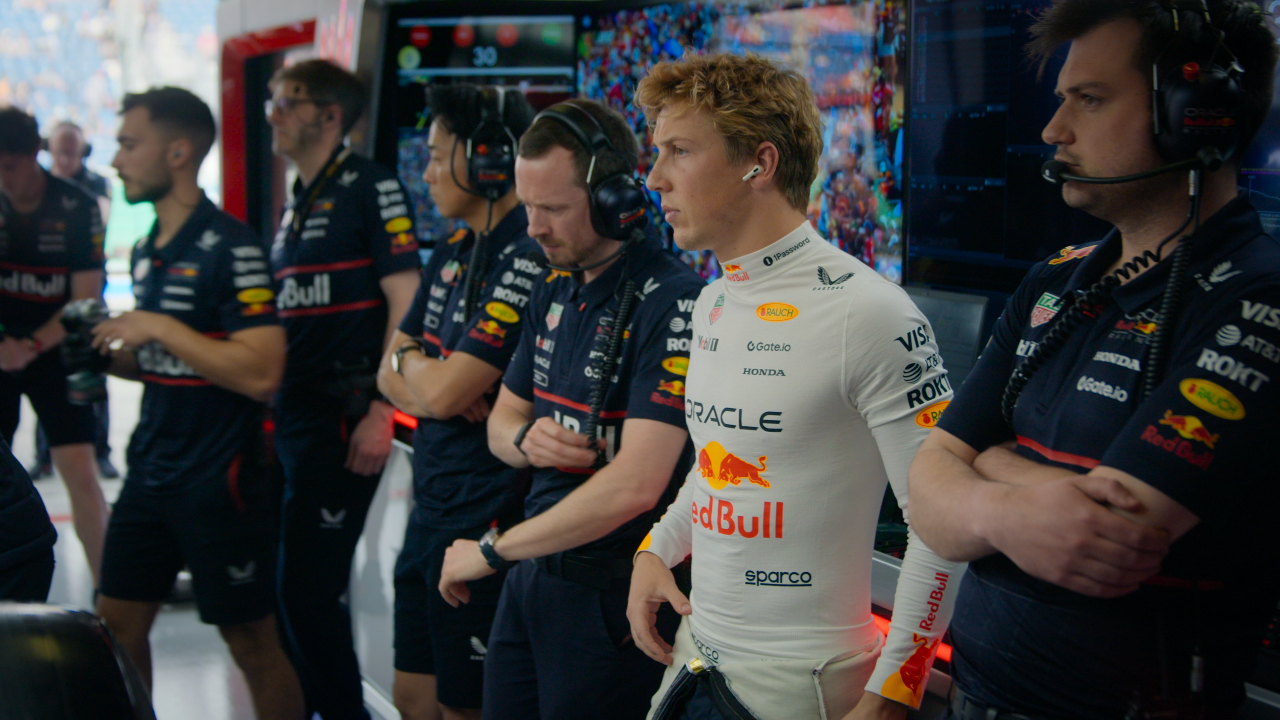 An F1 team watces a race in F1: Drive to Survive