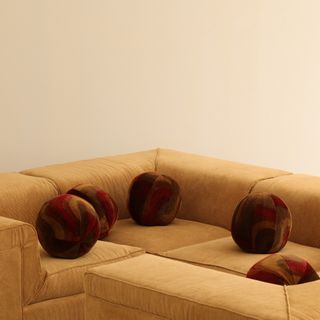 a pit sofa with round sphere phillows