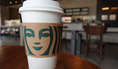 A Starbucks coffee cup sits on a table as the company reported supply shortages at some coffee shops on June 11, 2021 in Miami, Florida. 