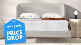 Leesa Sapira Hybrid Mattress on a gray bed with a stone bedside table