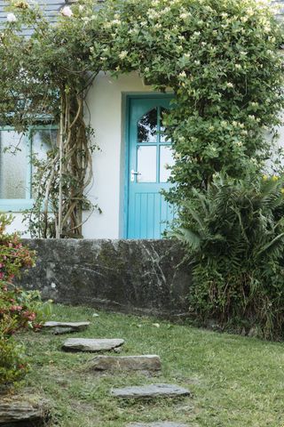 Blue door on exterior of Irish cottage