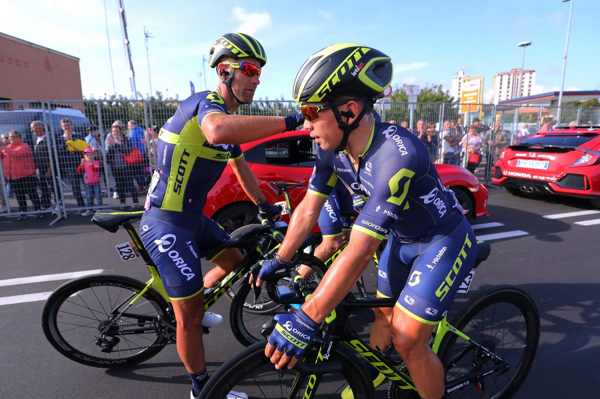 Svein Tuft gives teammate Caleb Ewan a pat on the shoulder after the narrow loss on stage 1