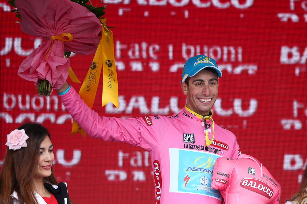 Fabio Aru donned the leader's pink jersey.