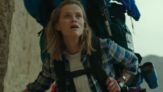 Reese Witherspoon wearing a big backpack while hiking in Wild