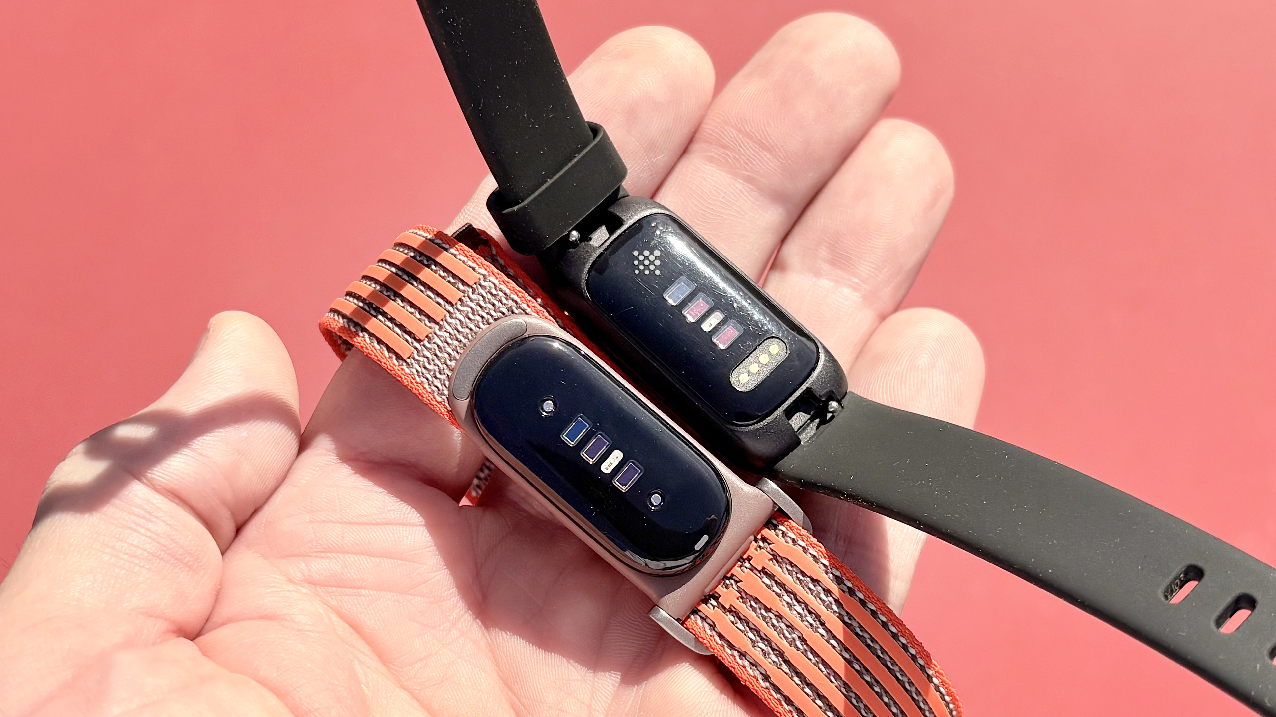 Close-up of the Fitbit Air next to the Fitbit Inspire 3