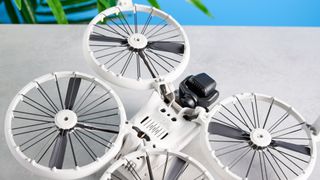 A gray DJI Flip drone with propeller guards