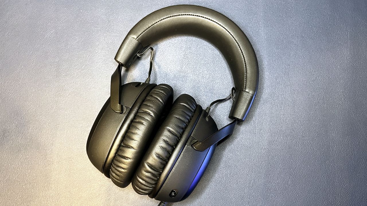 black hyperx gaming headset against desk