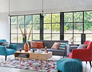 living room with rug on floor and sofaset with cushions