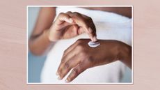 Close up image of woman's hands as she applies cream on the back of one of them, in a white frame against a dusky pink watercolour-style background