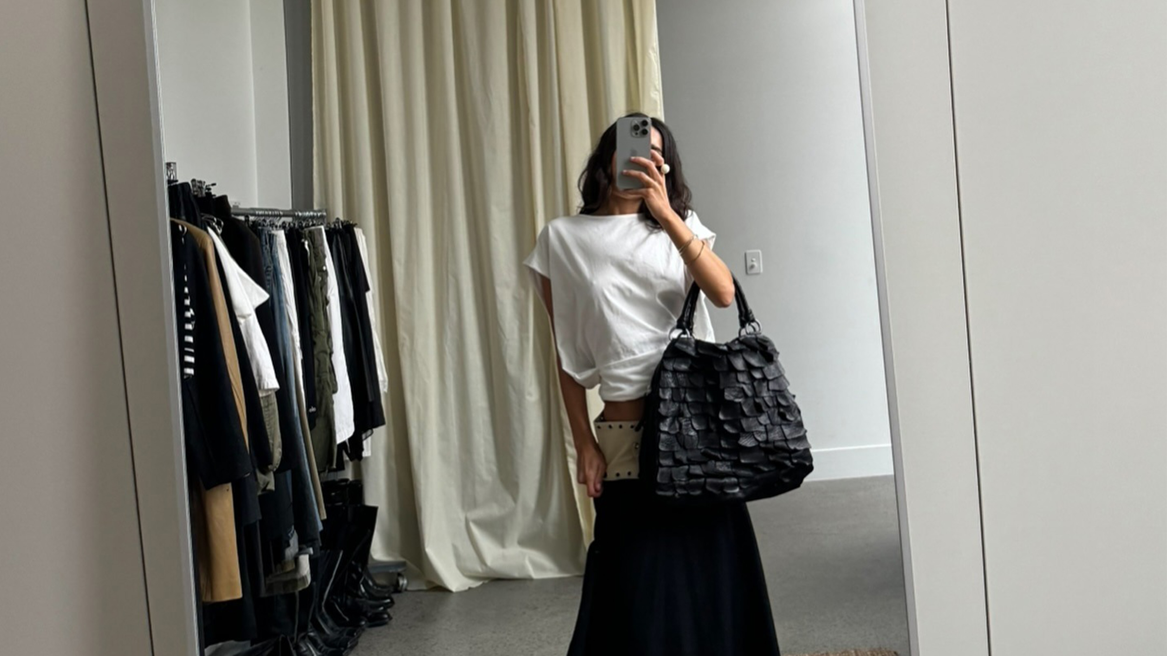 Camelia Farhoodi taking a mirror selfie.