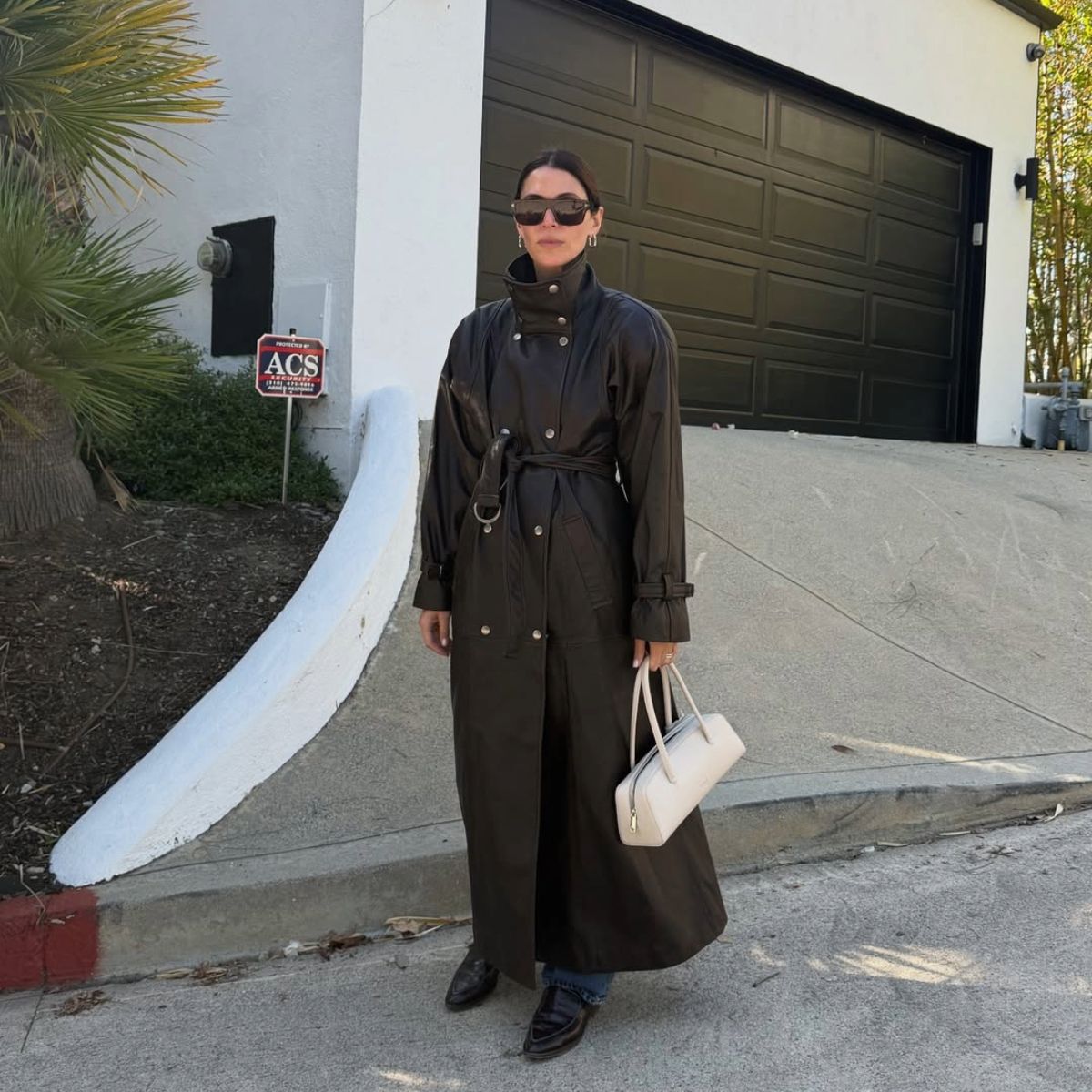 Jen Wonders in a funnel-neck leather jacket