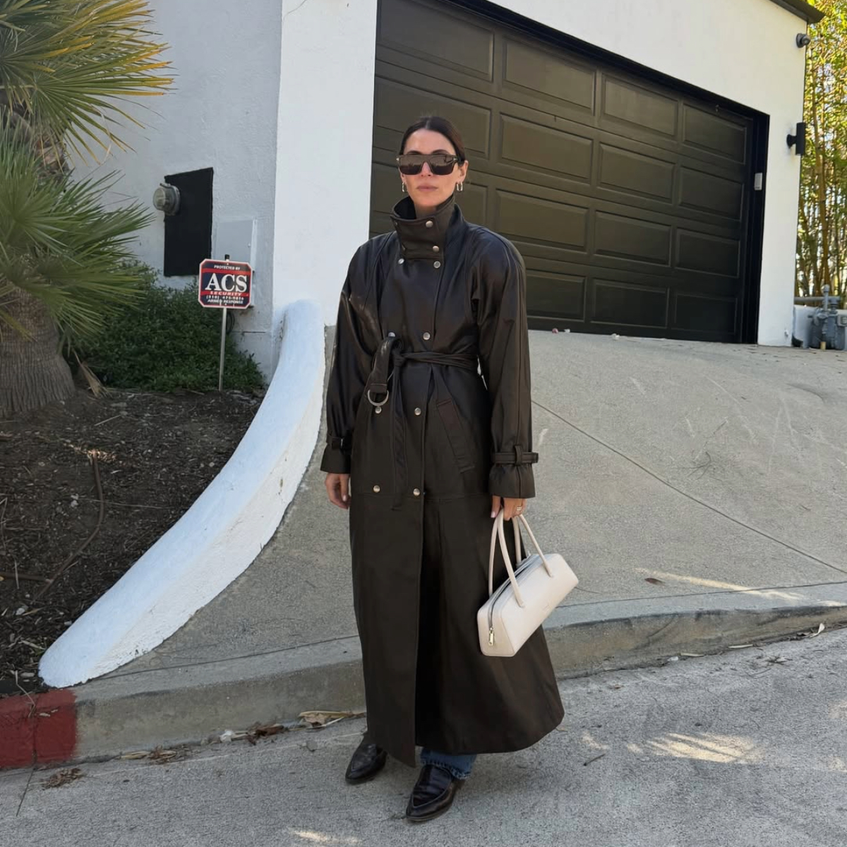 Jen Wonders in a funnel-neck leather jacket