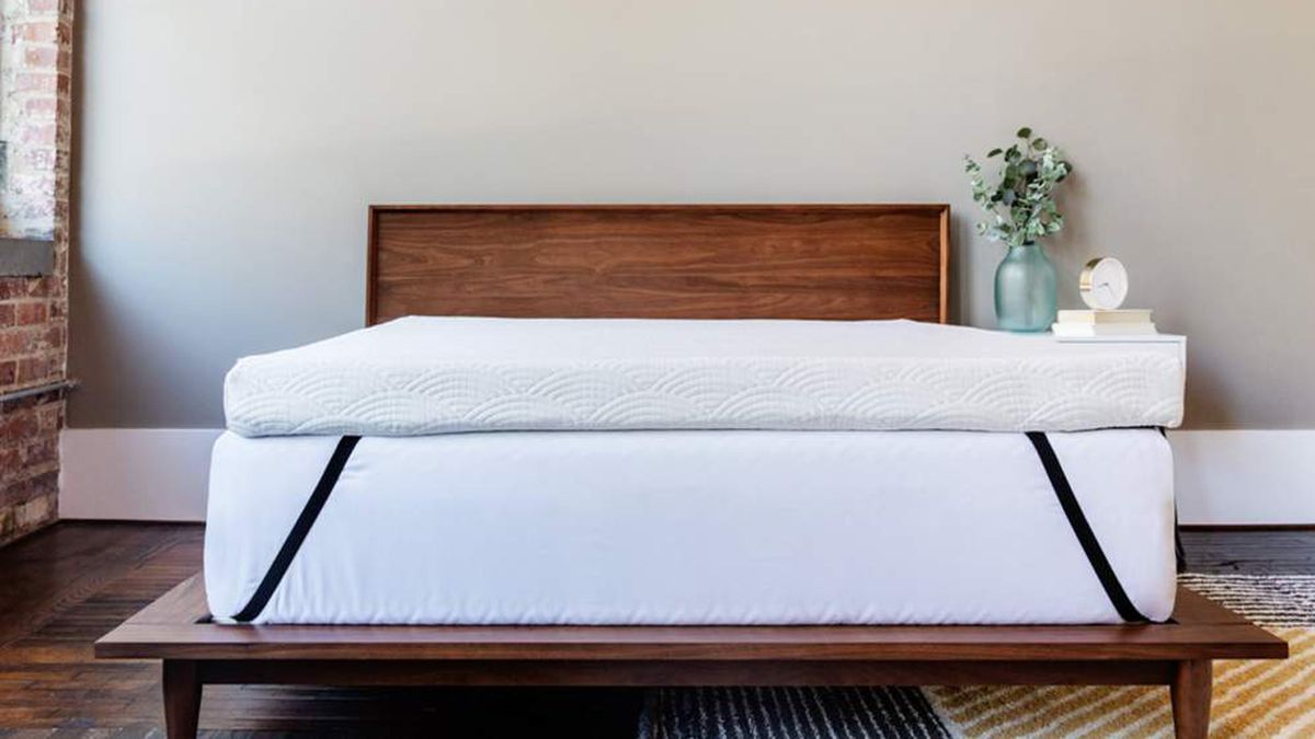 The ViscoSoft Active Cooling Topper on a bed in a white bedroom
