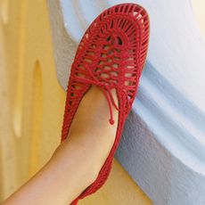 A pair of red knitted flats.