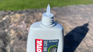 Close up of nozzle of Motul Chain Lube Dry bottle