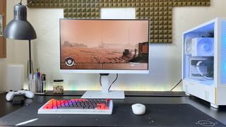 The BenQ GW2790QT Ergonomic Eye-Care monitor showing a scene from Starfield (Bethesda Game Studios) on a black desk with a keyboard, mouse, and white gaming PC