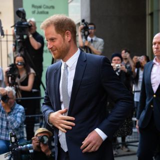 Prince Harry headed into High Court in the U.K. with photographers surrounding him