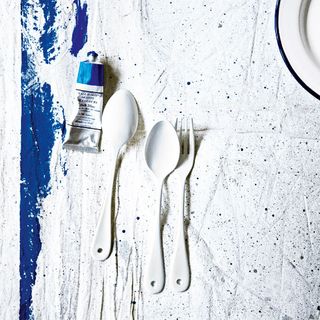 white enamel cutlery and cobalt blue artists paint