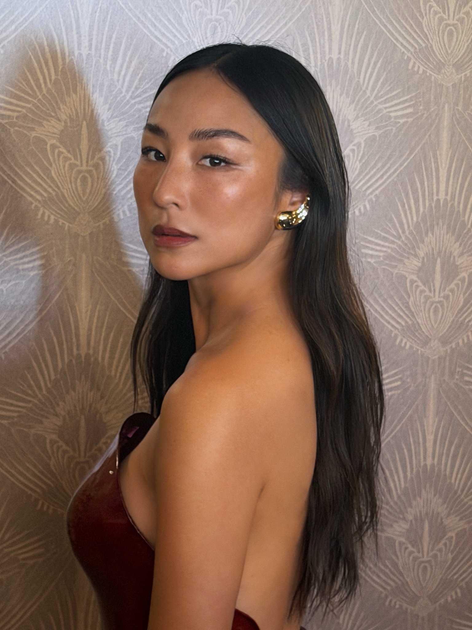 Greta Lee with long layered hair